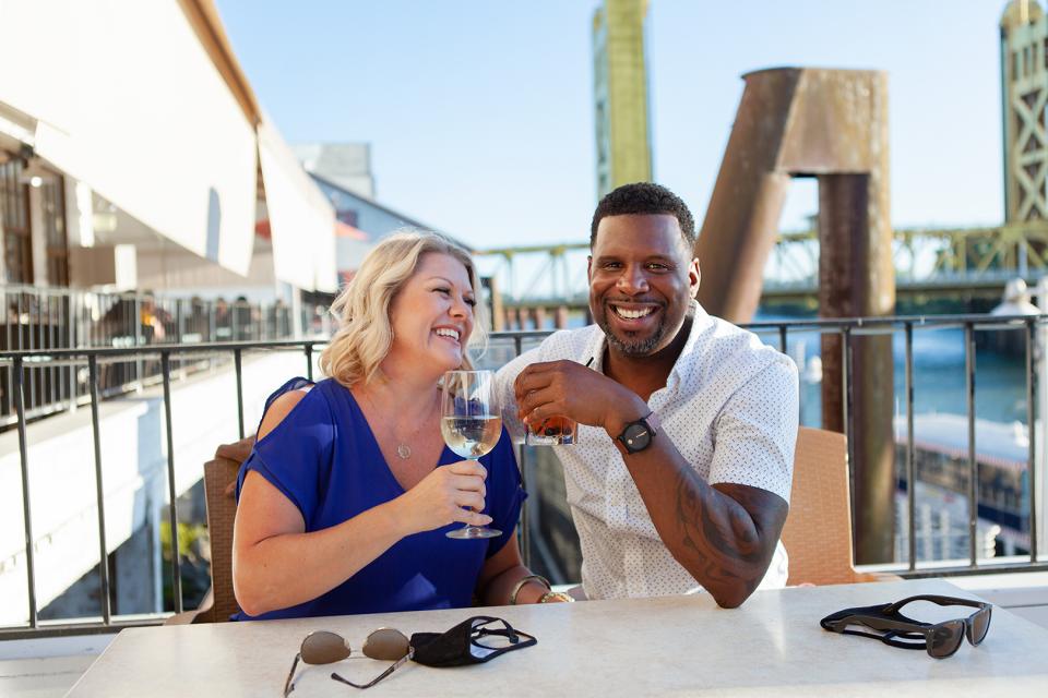 Couple eating and drinking at a restaurant