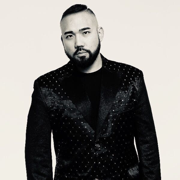 Comedian and magician Justin Rivera in a black embellished jacket