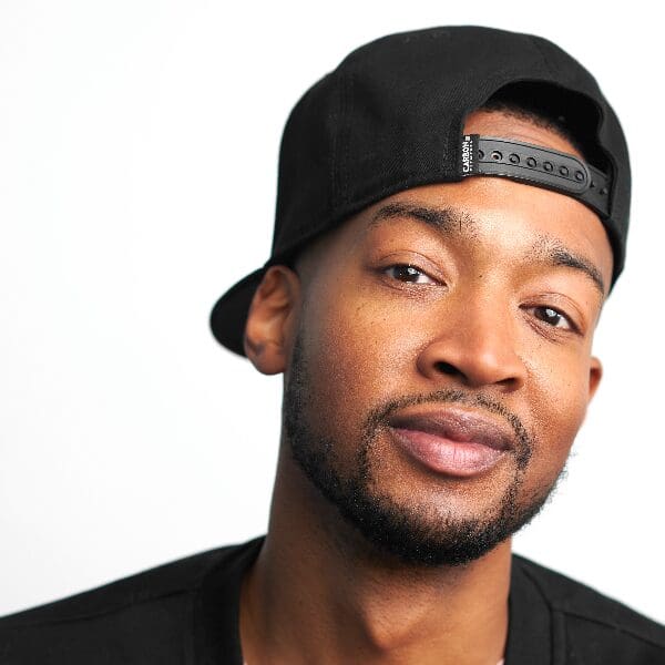 Comedian Keon Polee in a backwards black cap